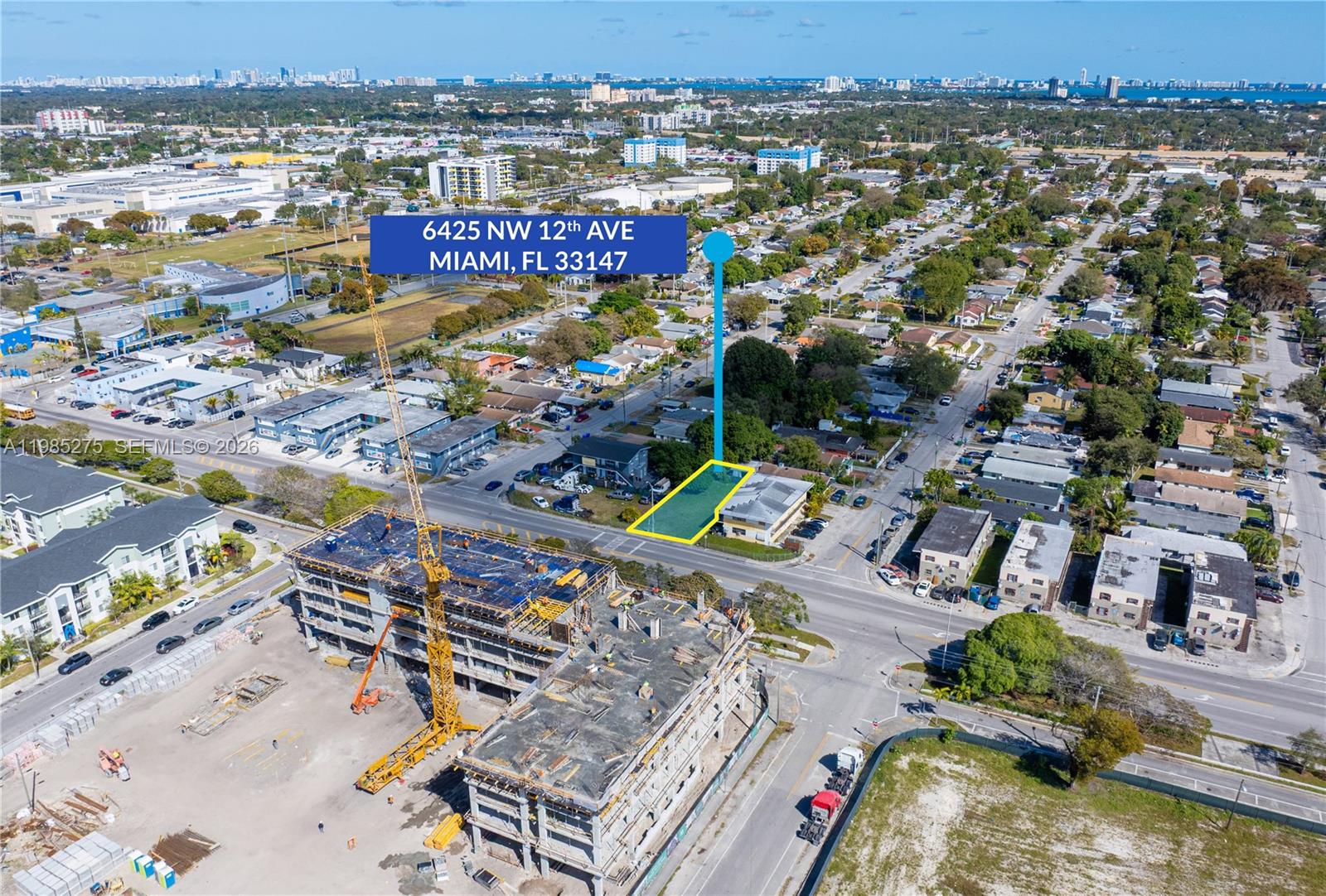 An aerial view shows a highlighted corner lot with a building near a construction site — 6425 NW 12th Ave, Miami FL 33150, MIAMI, FL