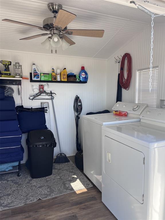 A laundry room features a ceiling fan, white paneled walls, a washer, and a dryer — 38201 MAGPIE WAY, LEESBURG, FL