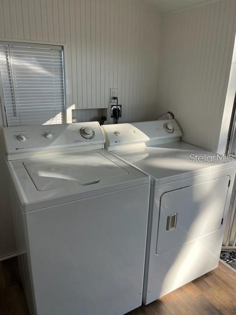 A laundry room features a white top-loading washing machine and a matching dryer — 38201 MAGPIE WAY, LEESBURG, FL