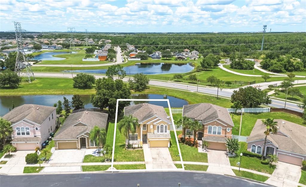 An aerial view shows a suburban house with a white outline on a residential street — 1518 SUN MEADOW DRIVE, ORLANDO, FL