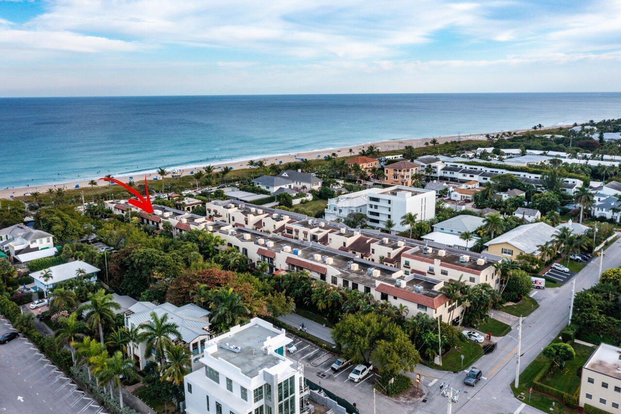 An aerial view of a multi-unit townhouse complex located near a sandy beach and ocean — 200 S Ocean Boulevard # 105, Delray Beach FL 33483, DELRAY BEACH, FL