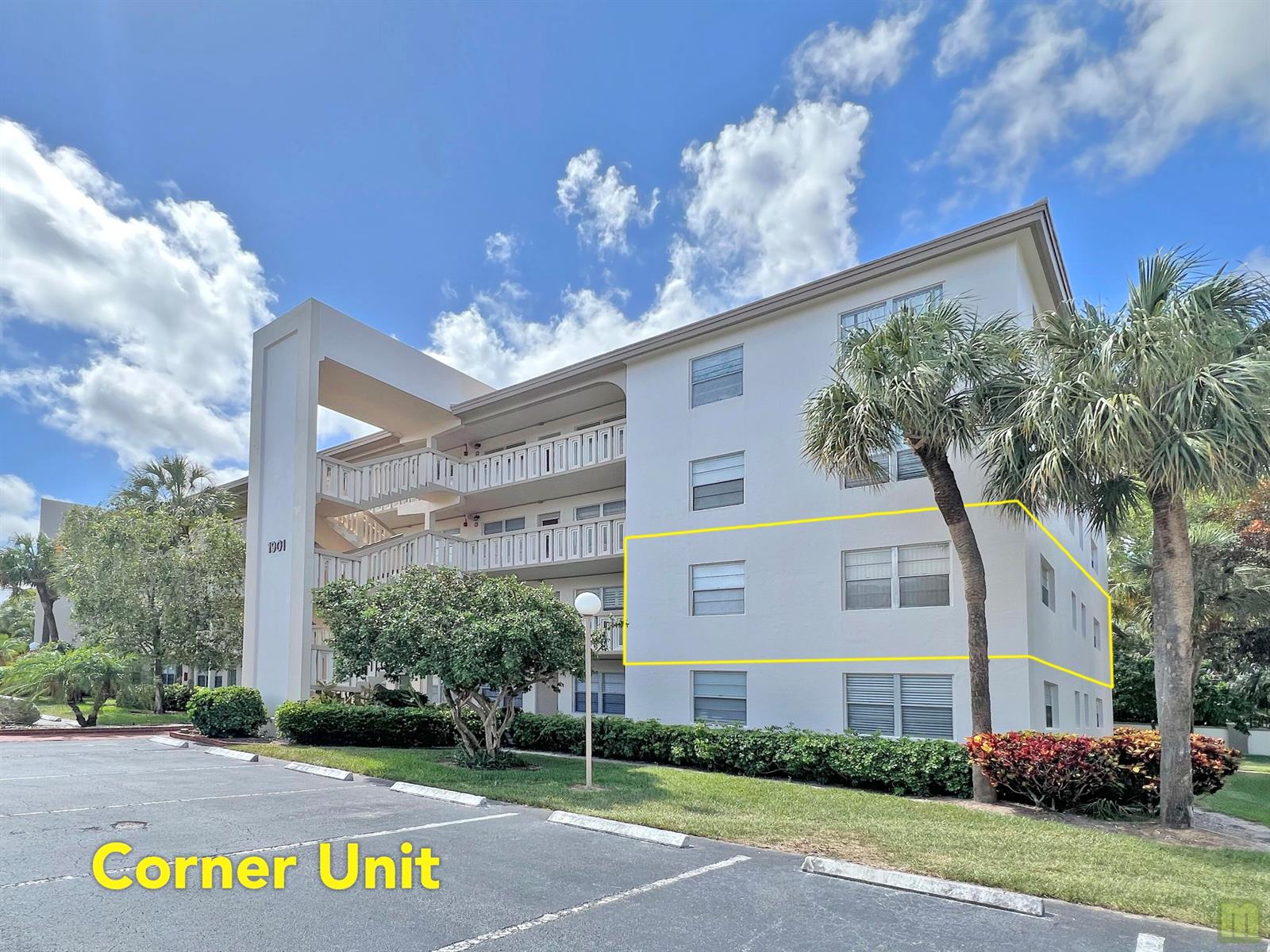 A three-story white apartment building with a corner unit highlighted by a yellow outline — 1901 Bermuda Circle # M2, Coconut Creek FL 33066, COCONUT CREEK, FL