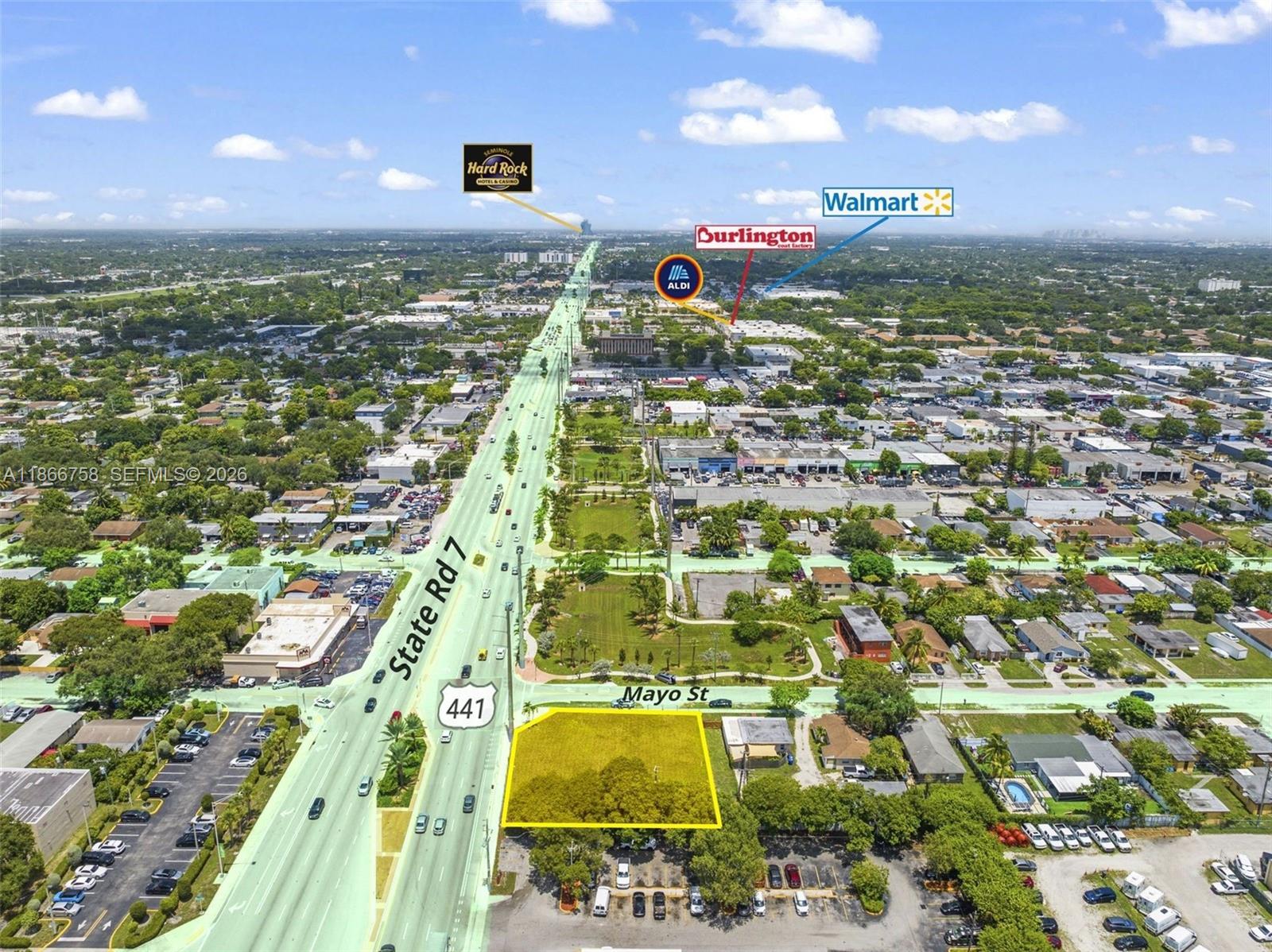 An aerial view shows a vacant lot highlighted in yellow at a street intersection — 1501 S State Road 7 Rd, Hollywood FL 33023, HOLLYWOOD, FL