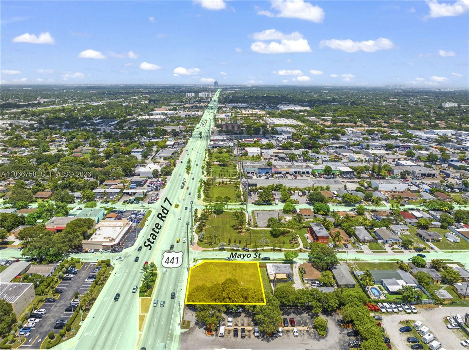 An aerial view highlights a vacant, rectangular lot located at the corner of a highway — 1501 S State Road 7 Rd, Hollywood FL 33023, HOLLYWOOD, FL