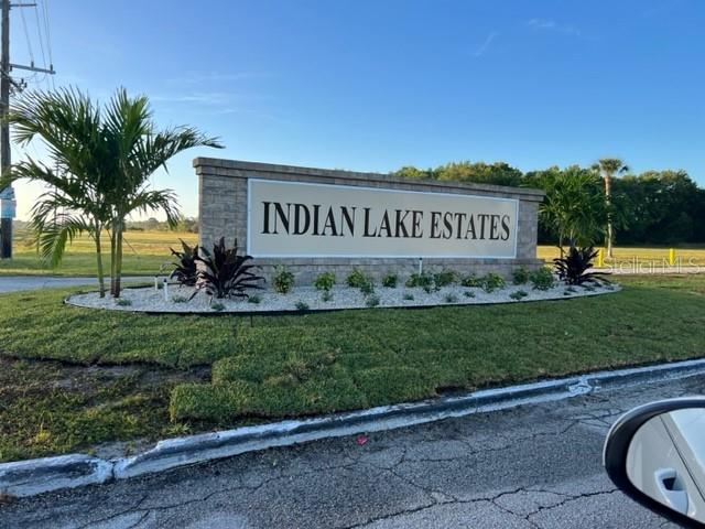 A stone monument sign for Indian Lake Estates stands in a landscaped grassy area — 0 OLEANDER DRIVE, INDIAN LAKE ESTATES, FL