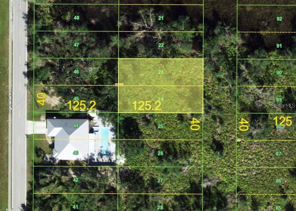 This is an aerial map showing a highlighted rectangular land parcel labeled 23 and 24 — 1093 SULSTONE DRIVE, PUNTA GORDA, FL