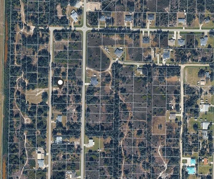 This is an aerial map view of a residential area with vacant lots and houses — 2090 HIGHLANDS ROAD, PUNTA GORDA, FL
