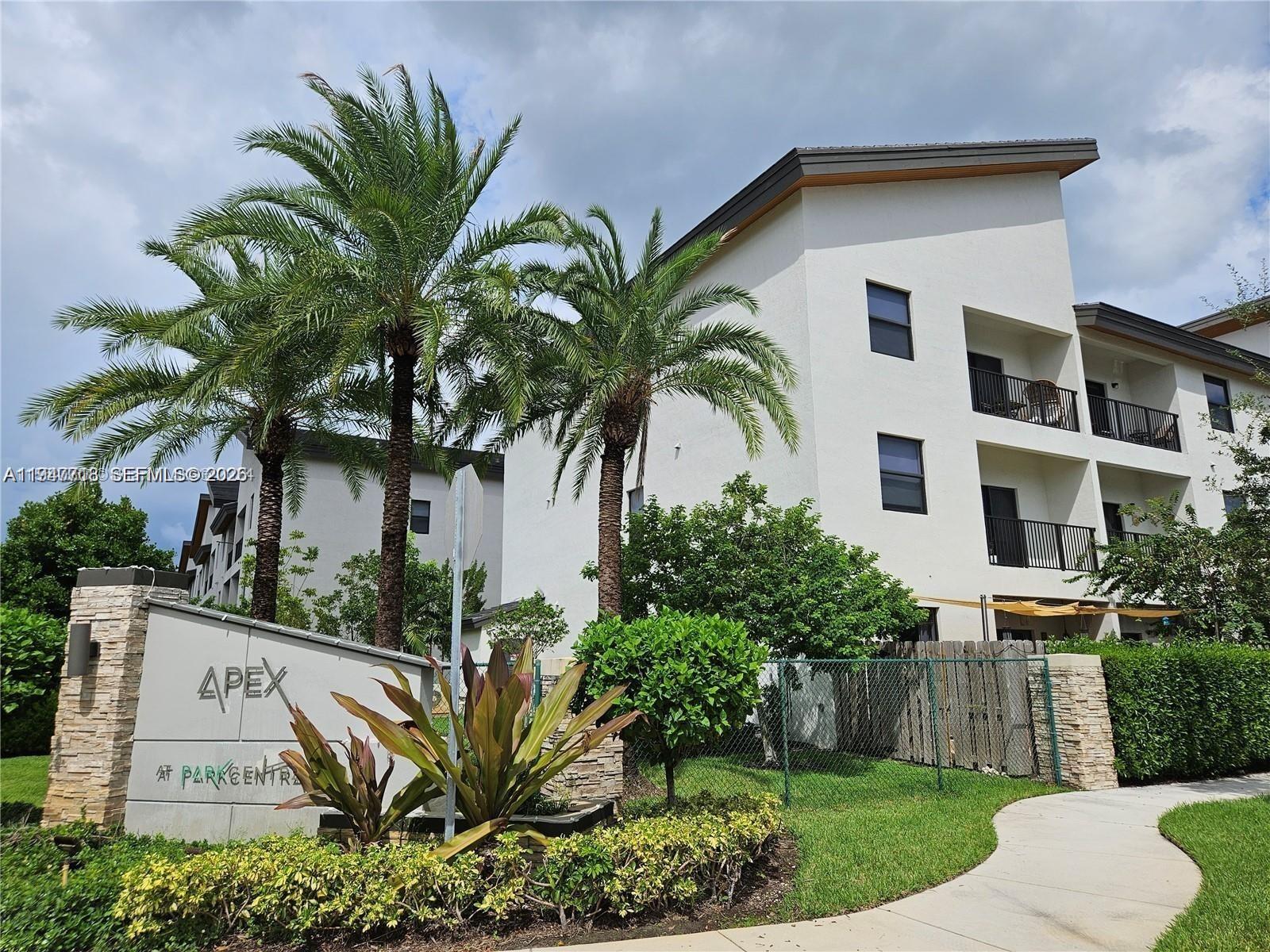 A sign for Apex at Park Central stands in front of a multi-story apartment building — 8151 NW 104th Ave # 34, Doral FL 33178, DORAL, FL
