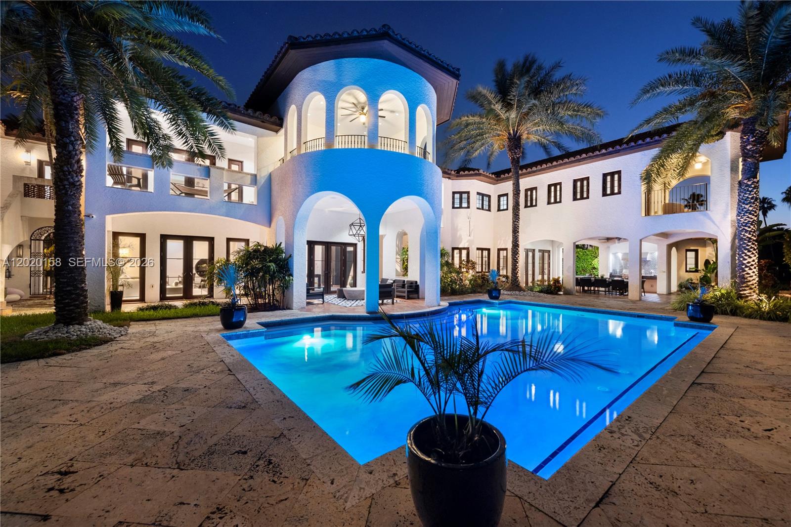 A two-story white stucco house with a pool, palm trees, and arched architectural details — 1201 NE 83rd St, Miami FL 33138, MIAMI, FL