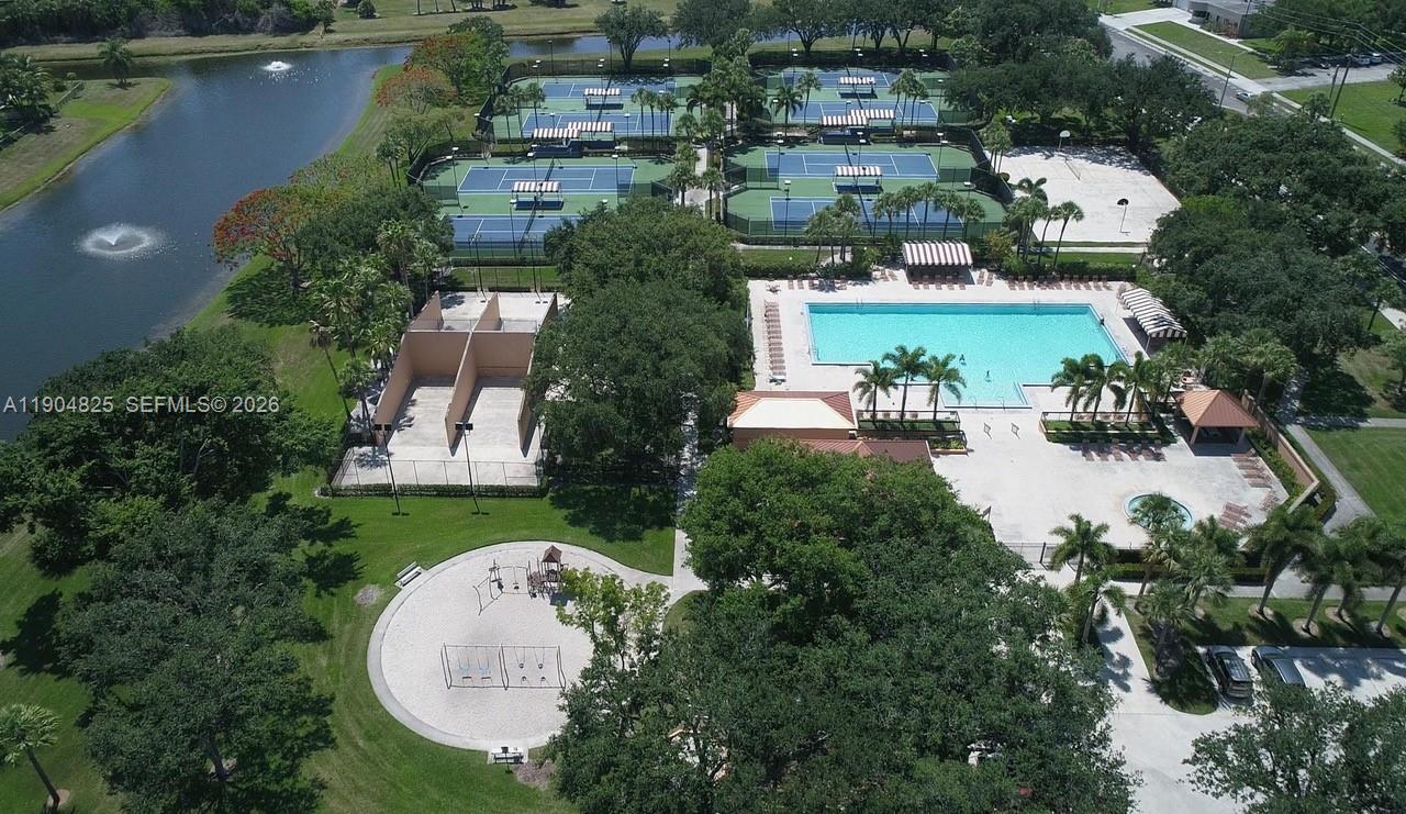 An aerial view shows a community recreation area with tennis courts, a pool, and playground — 157 Heritage Way, West Palm Beach FL 33407, WEST PALM BEACH, FL
