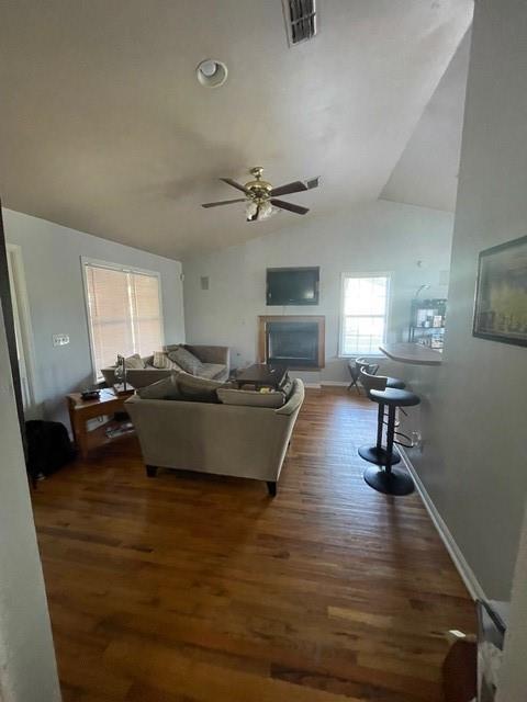 A living room features hardwood floors, a vaulted ceiling with a fan, and a fireplace — 2513 Colleen, Tallahassee FL 32303, TALLAHASSEE, FL