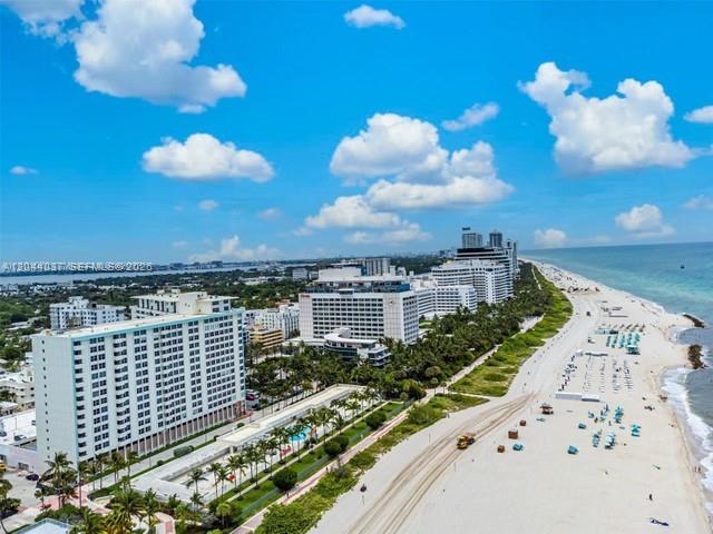 An aerial view shows high-rise buildings along a sandy beach bordering the ocean — 2899 Collins Ave # 1726, Miami Beach FL 33140, MIAMI BEACH, FL