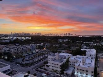 An elevated view of a city skyline at sunset over a suburban residential area — 2899 Collins Ave # 1726, Miami Beach FL 33140, MIAMI BEACH, FL