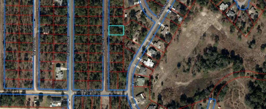 This is an aerial map showing a vacant residential lot highlighted in blue — LOT 19 NE 150TH COURT, WILLISTON, FL