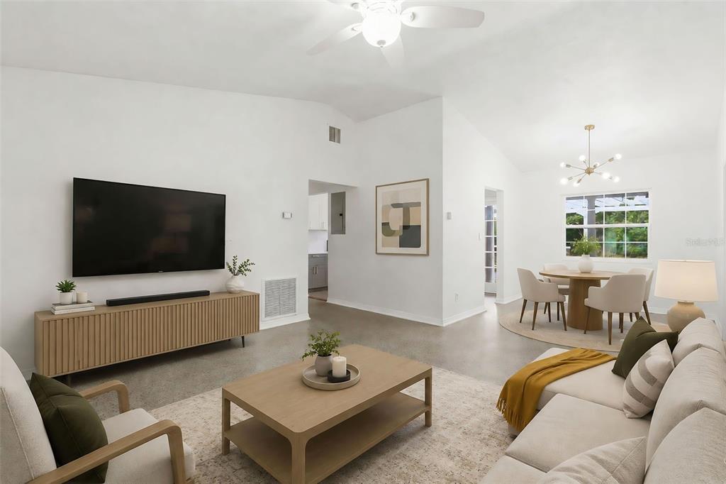 A single-story gray house with a white garage, front door, and a concrete driveway — 724 BRAIDWOOD LANE, ORLANDO, FL