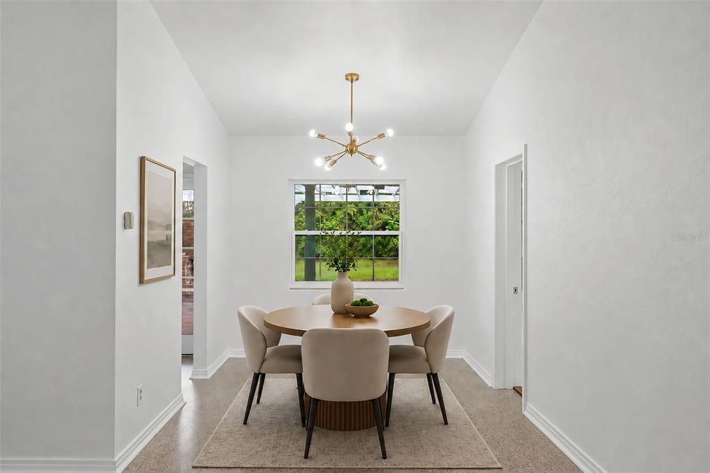 A gray single-story house with a white garage door, brick accents, and a concrete driveway — 724 BRAIDWOOD LANE, ORLANDO, FL
