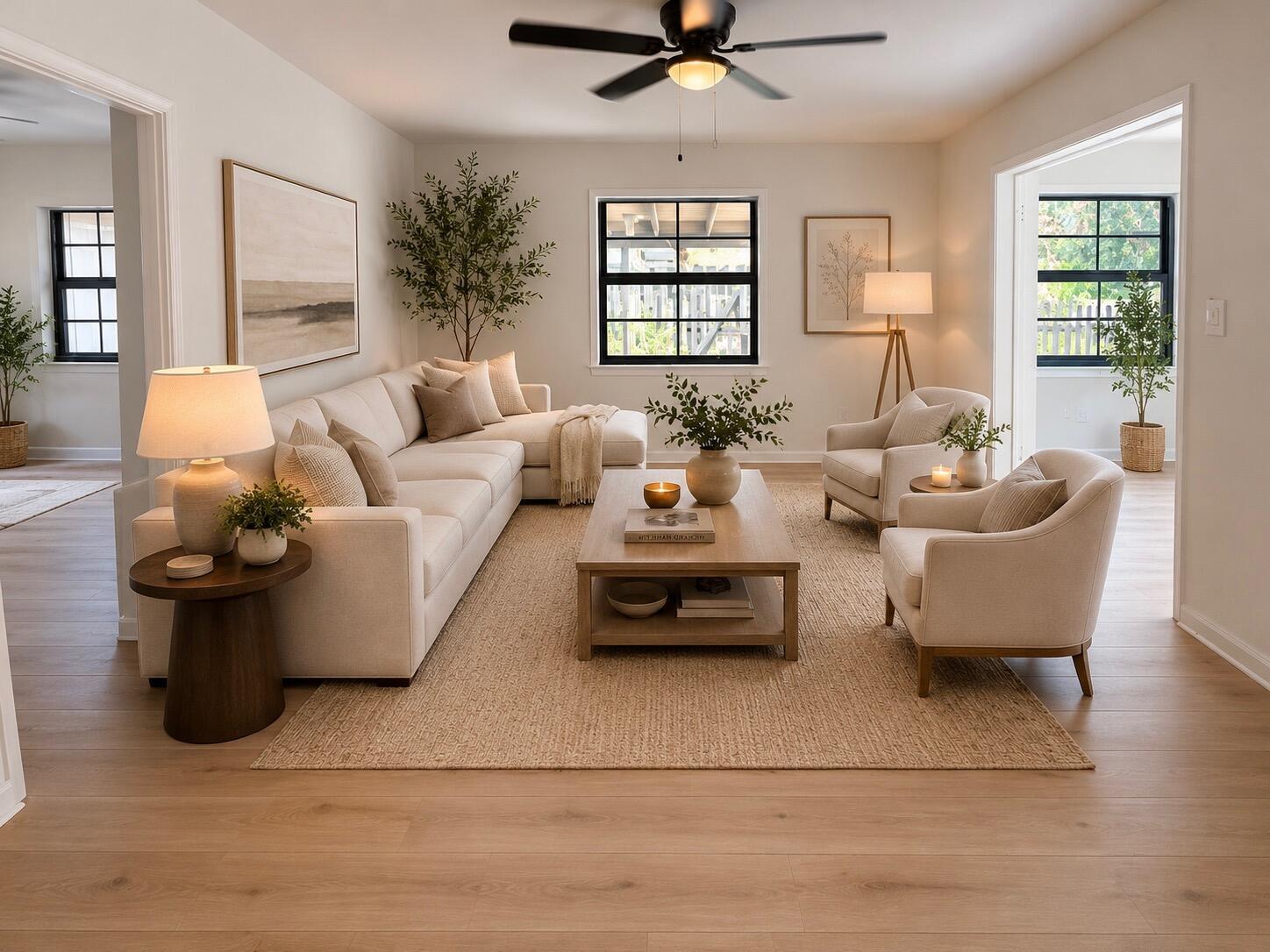 A bright living room features a sectional sofa, two armchairs, a coffee table, and windows — 521 48th Street, West Palm Beach FL 33407, WEST PALM BEACH, FL