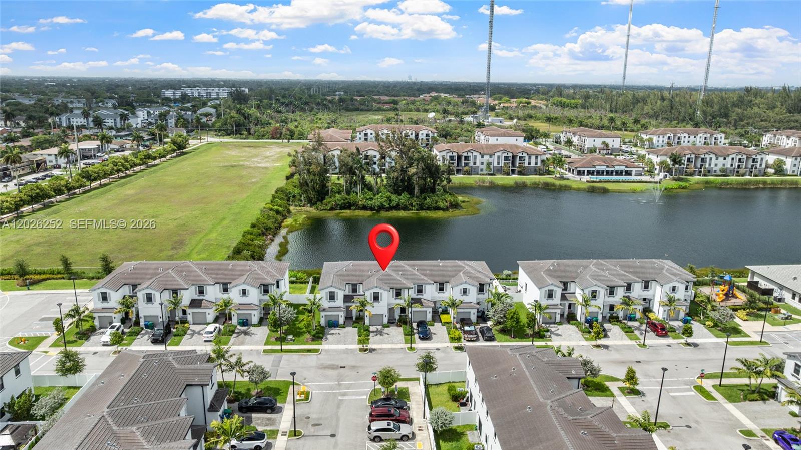 An aerial view shows a row of townhouses with a red location pin — 577 NW 204th St, Miami Gardens FL 33169, MIAMI GARDENS, FL