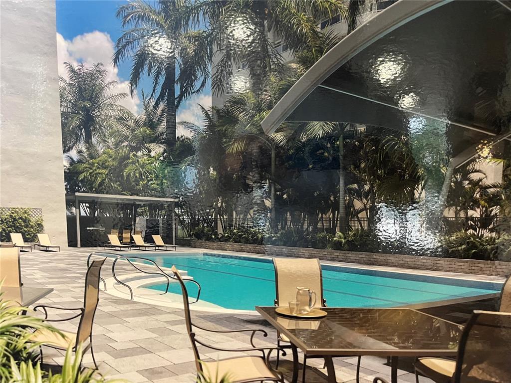 This is a rendering of an outdoor swimming pool area with lounge chairs and tables — 435 S GULFSTREAM AVENUE UNIT 206, SARASOTA, FL