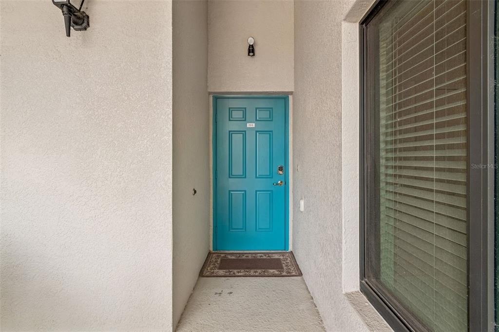 A stone waterfall feature serves as the entrance sign for the River Strand community — 6715 GRAND ESTUARY TRAIL UNIT 203, BRADENTON, FL