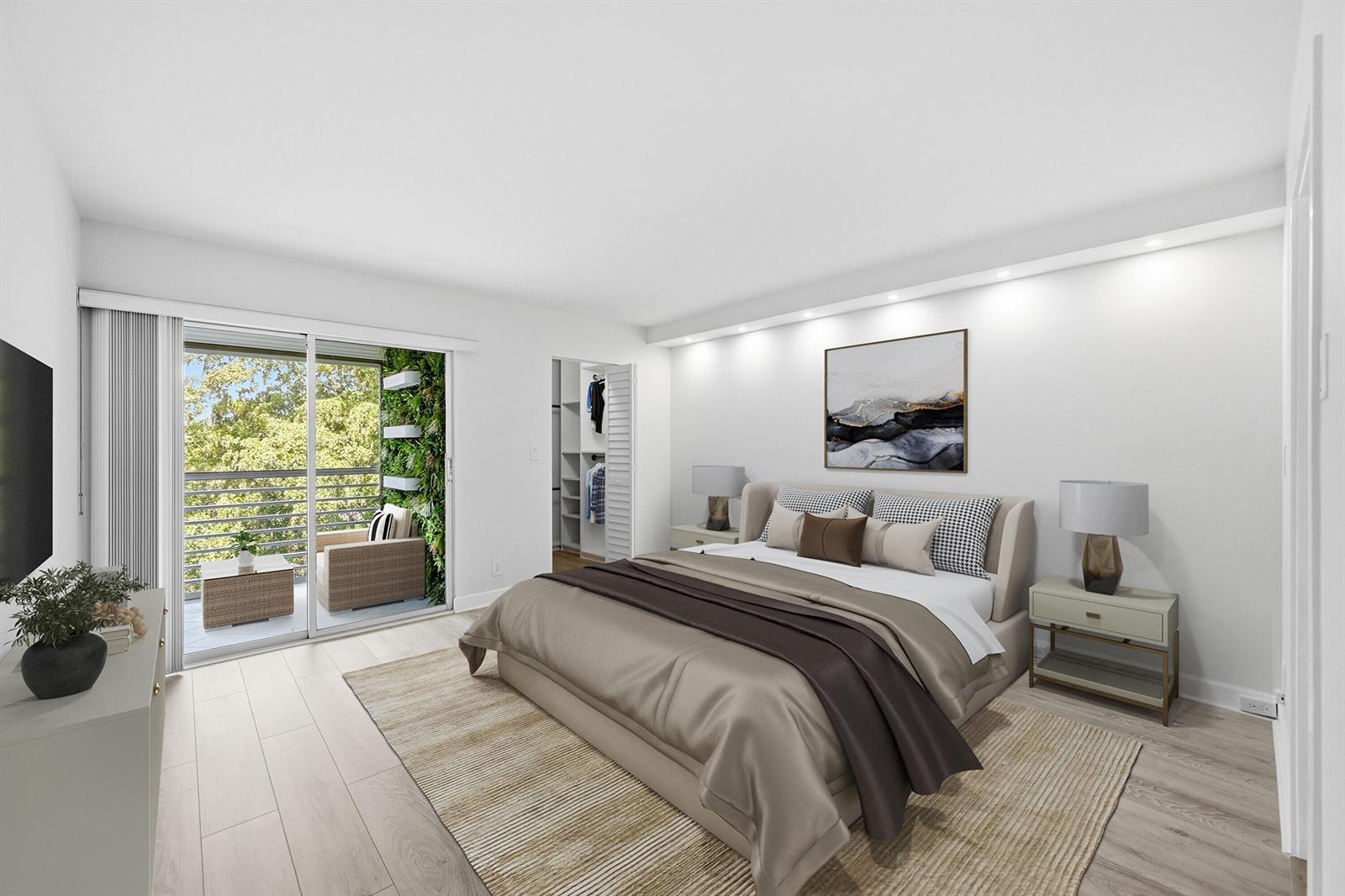 This bedroom features a bed, a walk-in closet, and a balcony with a vertical garden — 2006 Granada Drive # M3, Coconut Creek FL 33066, COCONUT CREEK, FL
