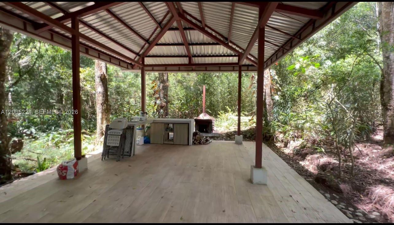 An open-air pavilion with a metal roof, tile flooring, and an outdoor kitchen area — SAN RAFAEL CASA No usar, FL, FL