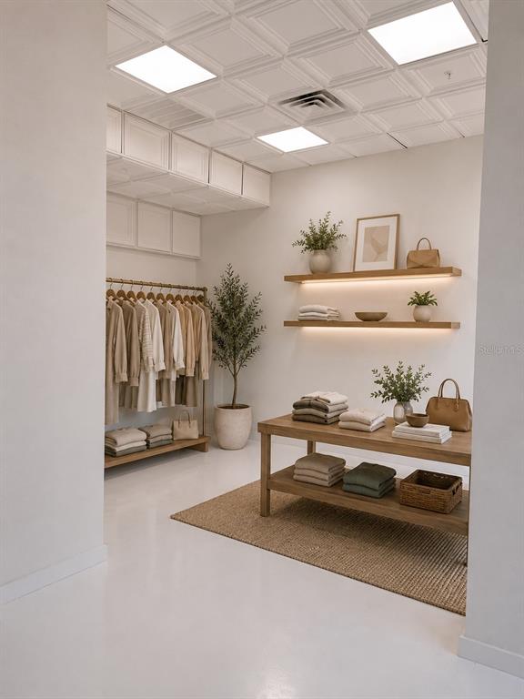 This is a rendering of a boutique-style walk-in closet with neutral tones and wooden shelving — 1558 4TH STREET UNIT 104, SARASOTA, FL