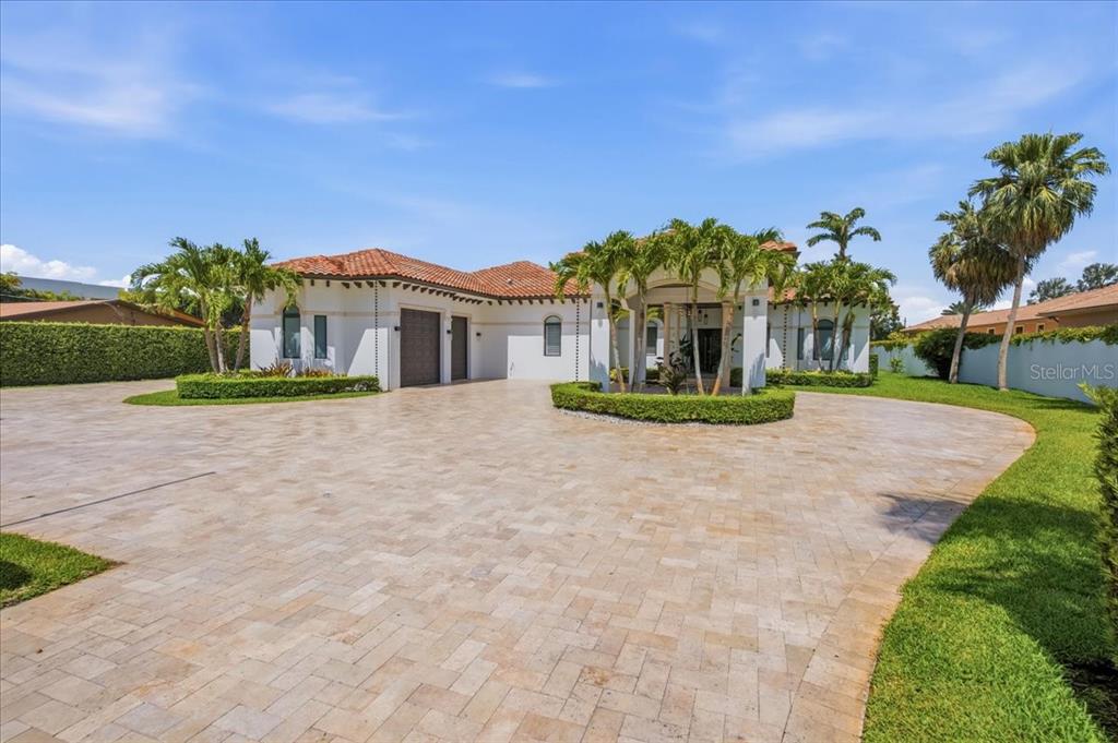 A single-story house with a tiled roof and a large paved circular driveway — 331 SW 124TH AVENUE, MIAMI, FL