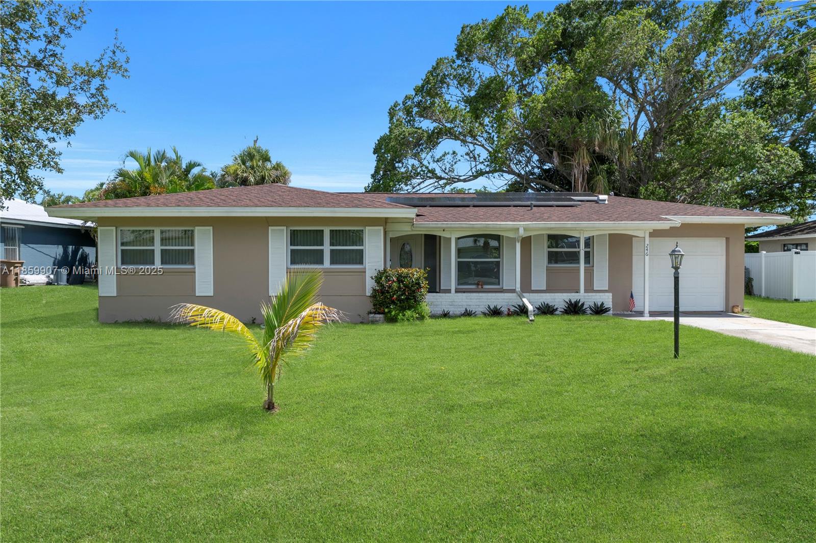 A single-story house with a brown roof, tan exterior, and a front lawn — 246 SE 44th st, Cape Coral FL 33904, CAPE CORAL, FL