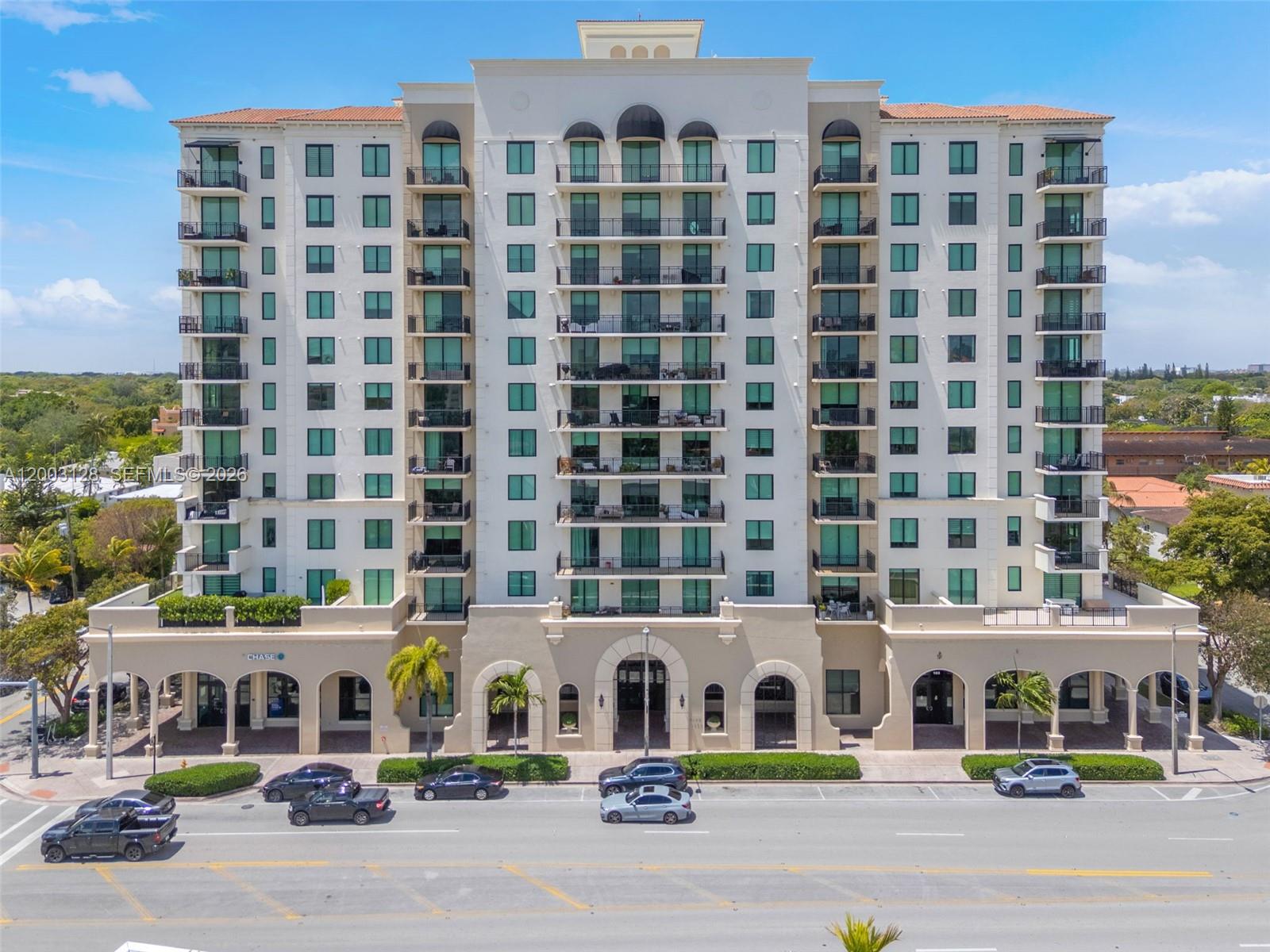 A multi-story residential building with balconies and a ground-floor Chase bank storefront — 1300 Ponce De Leon Blvd # 815, Coral Gables FL 33134, CORAL GABLES, FL