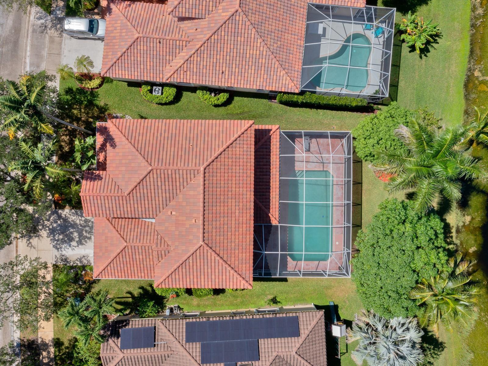 An aerial view shows three suburban houses with tiled roofs, swimming pools, and landscaped yards — 4032 Pinewood Lane, Weston FL 33331, WESTON, FL