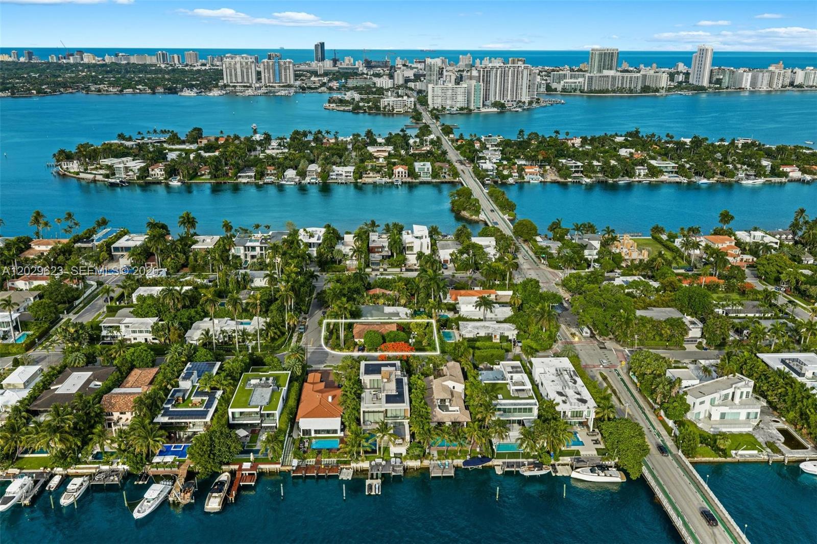 An aerial view shows a residential property outlined in white within a waterfront neighborhood — 455 W Dilido Dr, Miami Beach FL 33139, MIAMI BEACH, FL