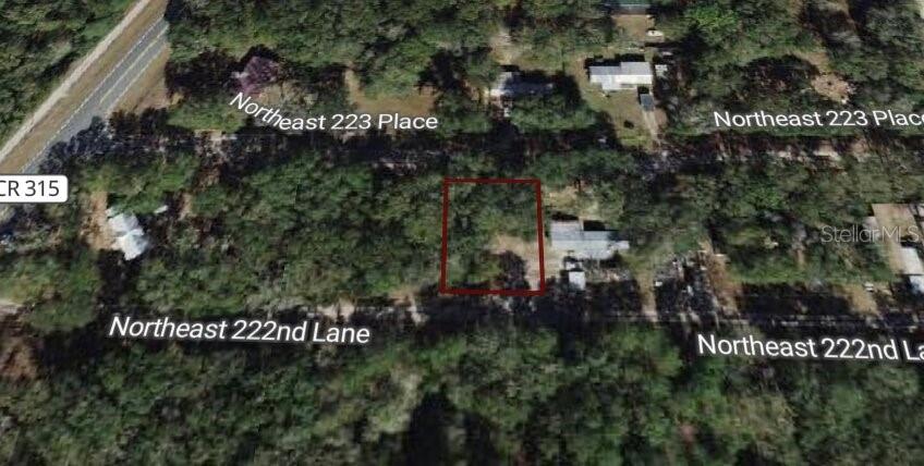 This aerial map shows a rectangular plot of land outlined in red near a road — 0 NE 222 NULL LN, FORT MC COY, FL