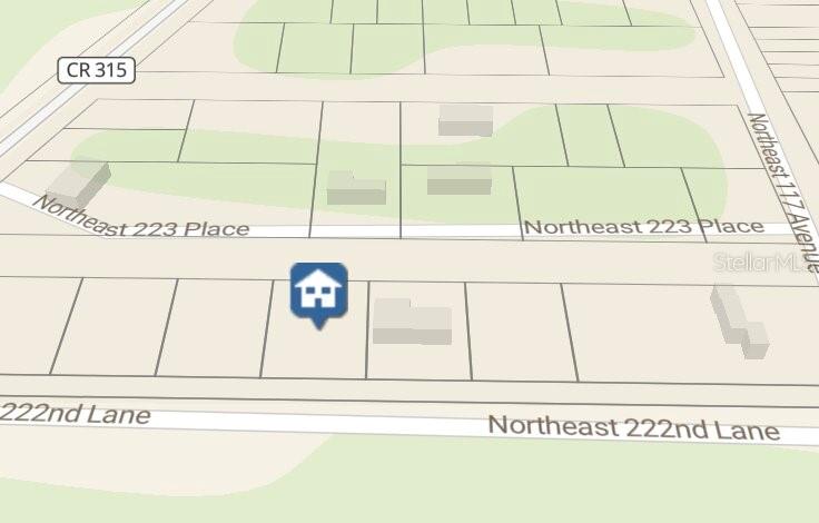 This is a map showing property lines and building footprints along Northeast 223 Place — 0 NE 222 NULL LN, FORT MC COY, FL