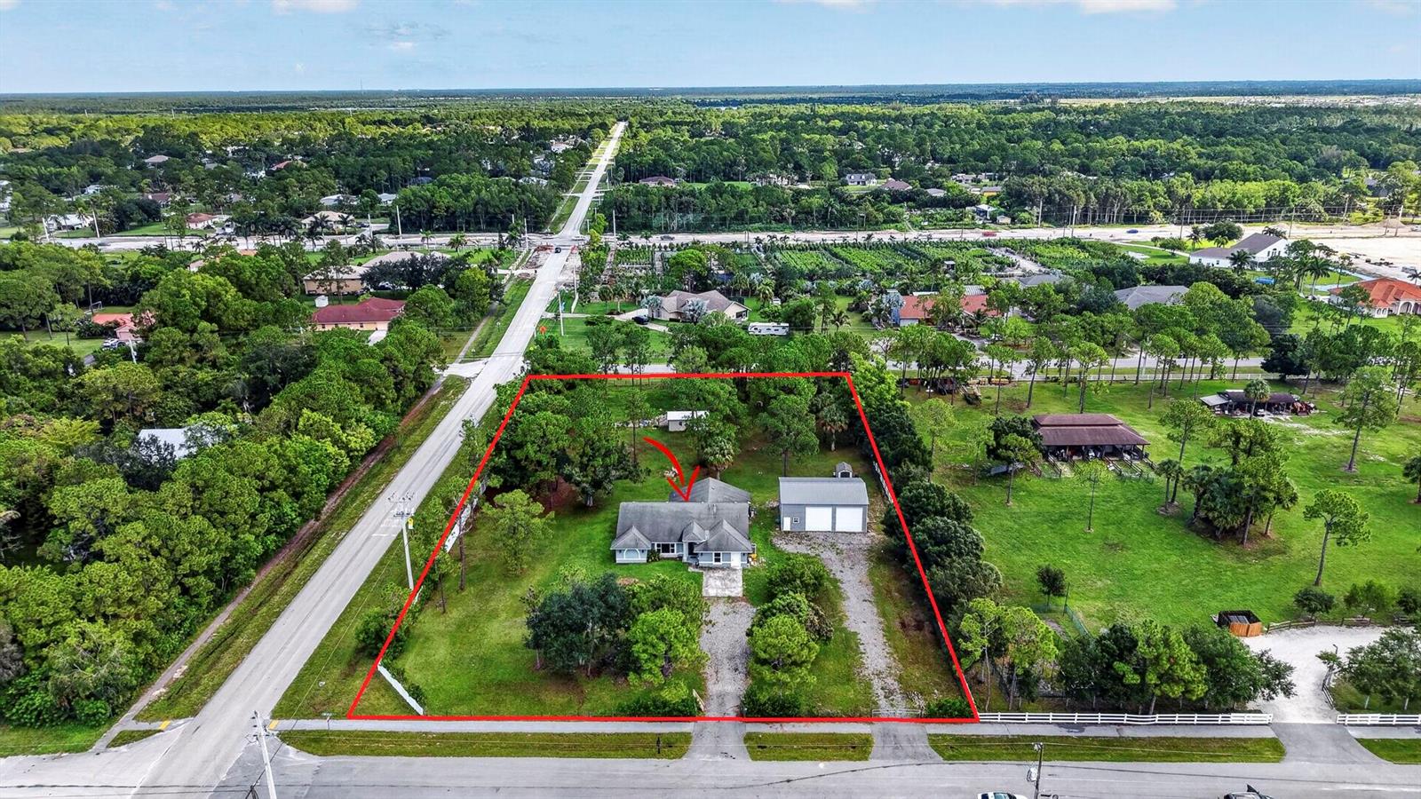 An aerial view shows a single-story house and detached garage on a large, fenced lot — 14935 89th Place N, Loxahatchee FL 33470, LOXAHATCHEE, FL