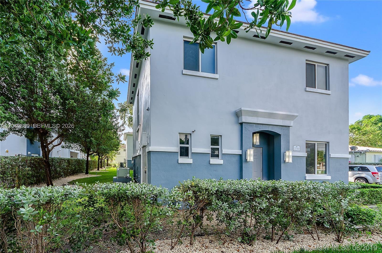 A two-story house with light blue stucco siding and a dark blue lower exterior trim — 2732 SW 26 St # 2732, Miami FL 33133, MIAMI, FL