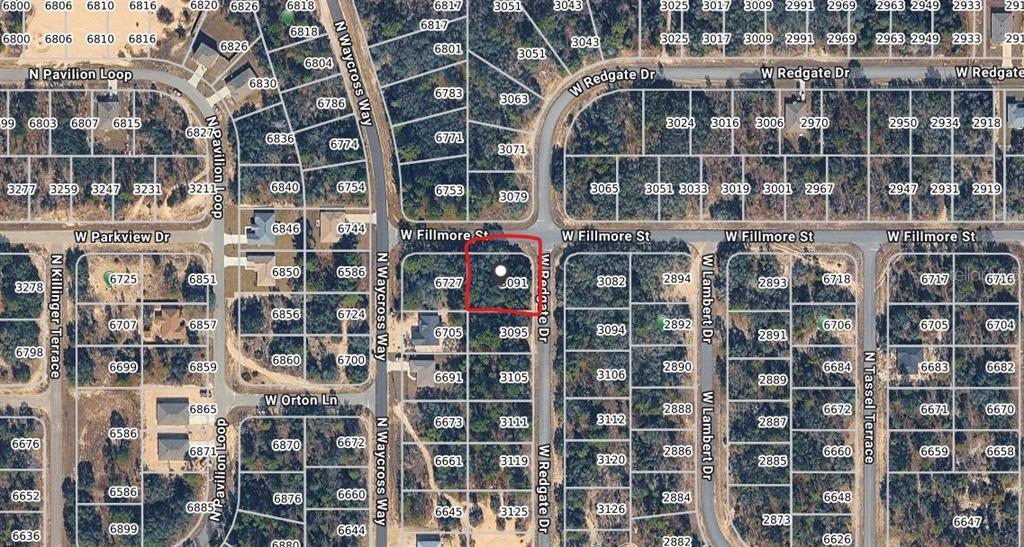 This is an aerial map showing a vacant lot highlighted in red within a neighborhood — 3091 W REDGATE DRIVE, DUNNELLON, FL