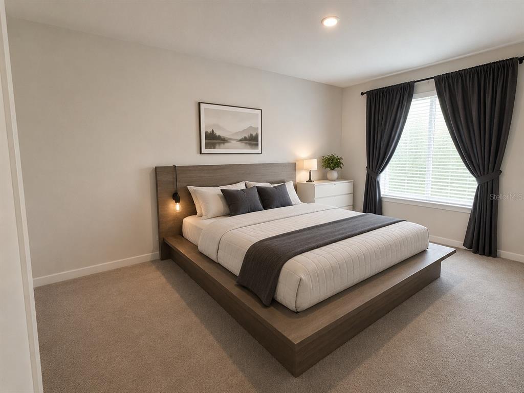 A bedroom features a platform bed with a wooden headboard, dark curtains, and carpeted flooring — 2393 PENGUIN BOULEVARD, DAVENPORT, FL