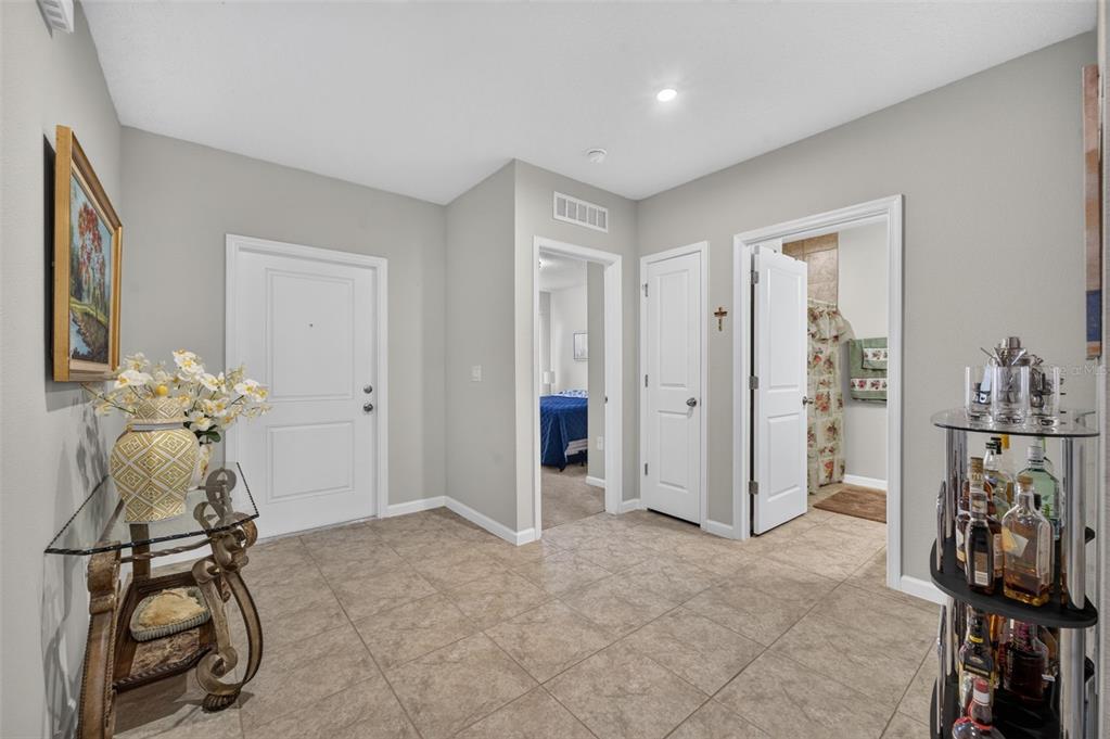 A kitchen with wood cabinets, granite countertops, stainless steel appliances, and a breakfast bar — 341 WINTER BLISS LANE, MOUNT DORA, FL