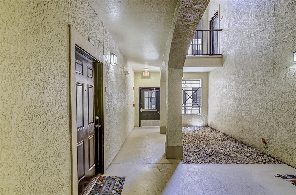 An aerial view shows a swimming pool, patio, and landscaping between multi-story apartment buildings — 114 VISTA VERDI CIRCLE UNIT 116, LAKE MARY, FL