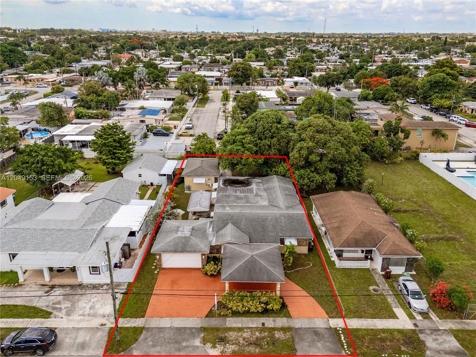 An aerial view shows a single-story house with a driveway and a red-outlined property boundary — 292 W 39th Pl, Hialeah FL 33012, HIALEAH, FL