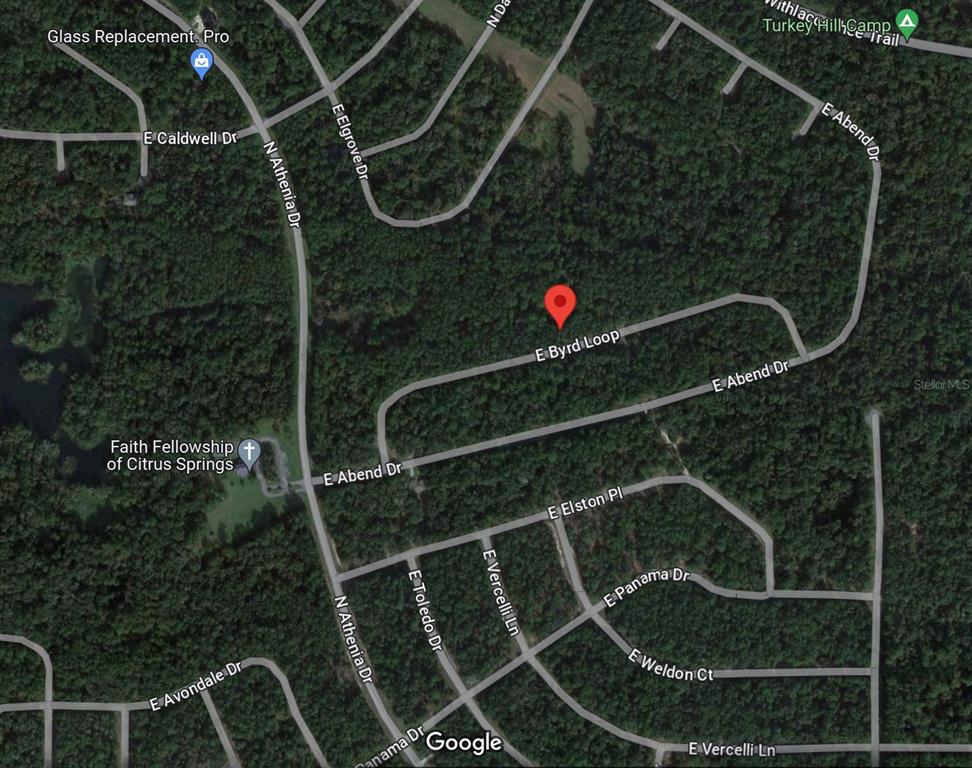 This is a satellite map view of a residential area with streets and wooded lots — 719 E BYRD LOOP, DUNNELLON, FL