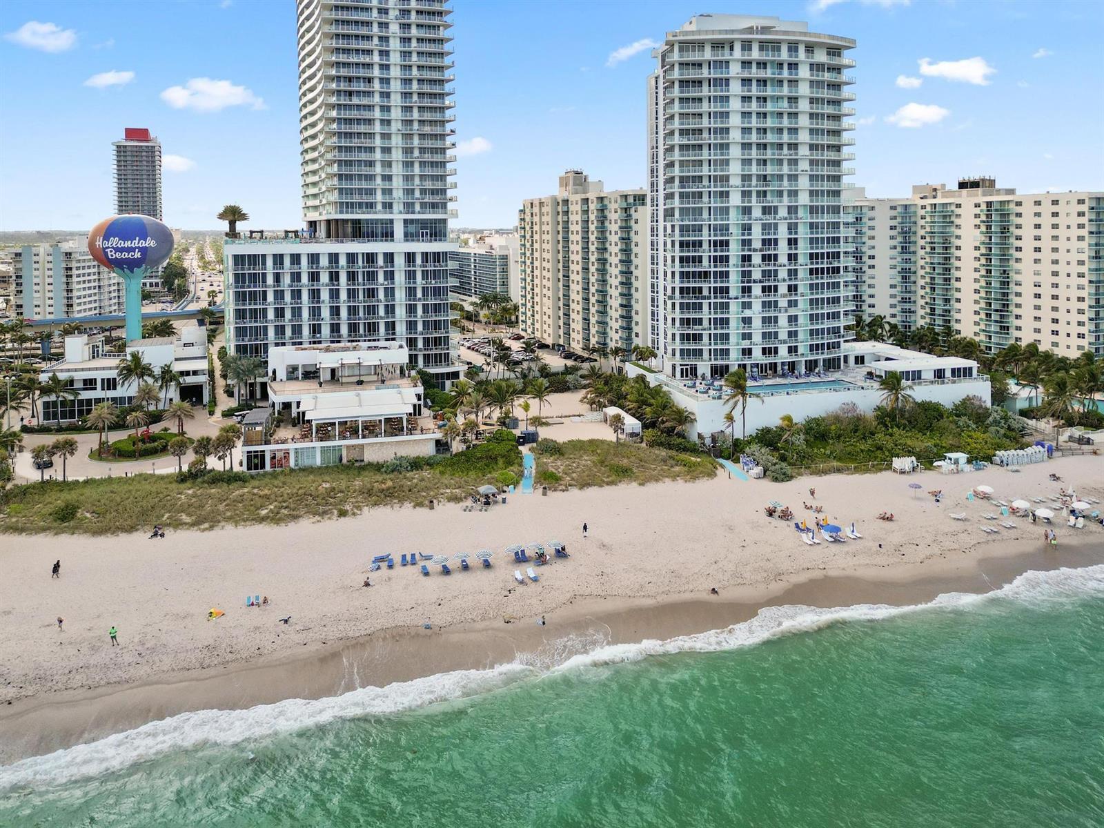 An aerial view of a beach with high-rise buildings and a Hallandale Beach water tower — 4001 S Ocean Drive # 8E, Hollywood FL 33019, HOLLYWOOD, FL