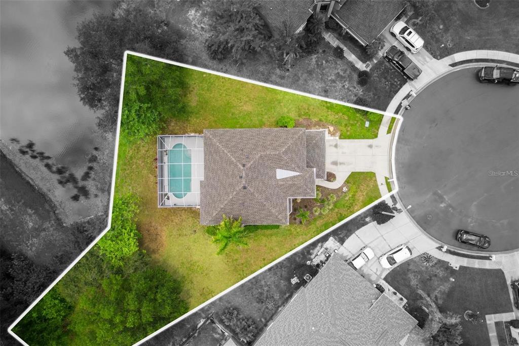 An aerial view shows a house with a pool and a large yard on a cul-de-sac — 4705 78TH COURT E, BRADENTON, FL