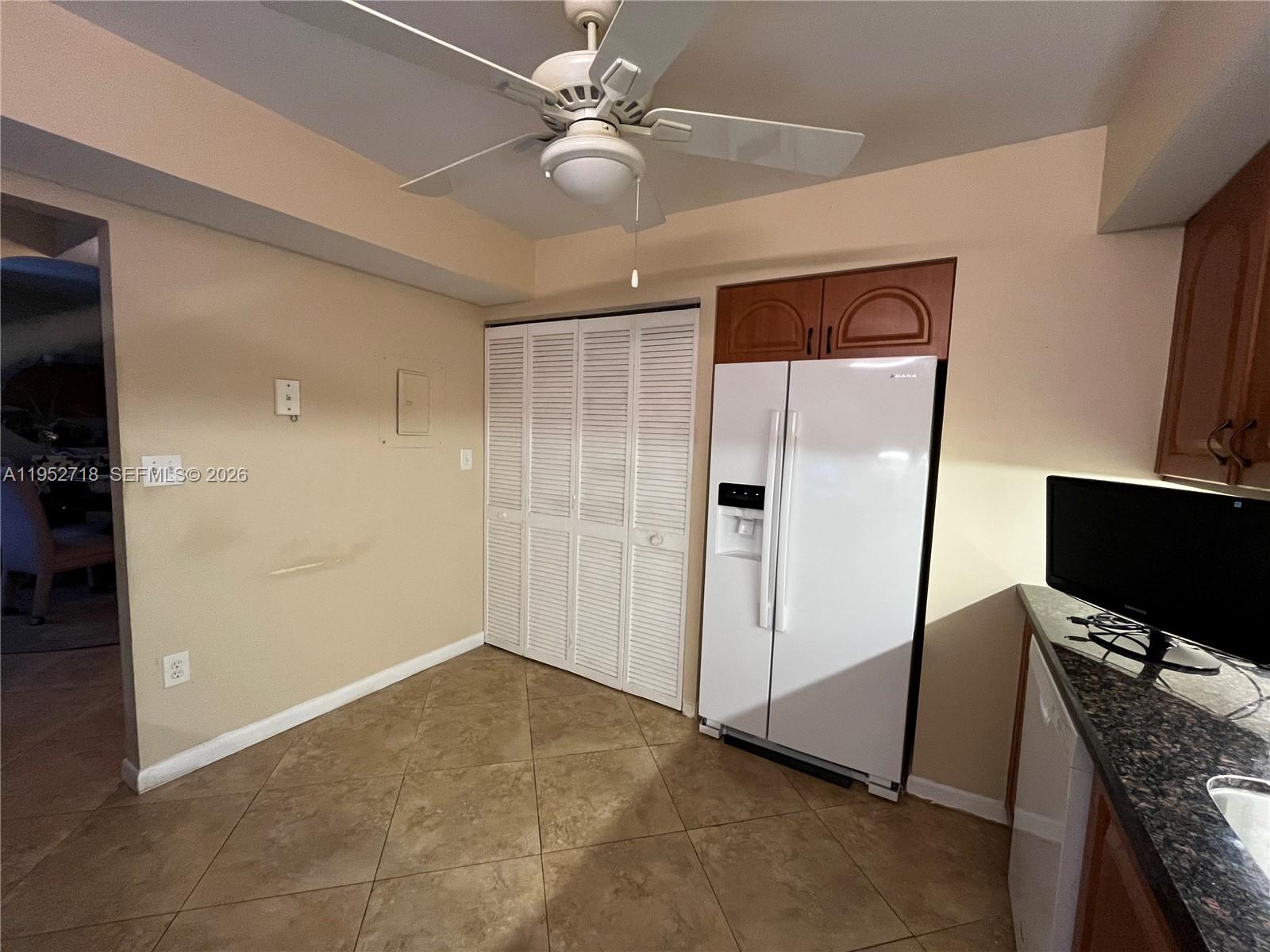 A dining room features a glass-topped table, six upholstered chairs, and a chandelier — 2806 N 46th Ave # D537, Hollywood FL 33021, HOLLYWOOD, FL
