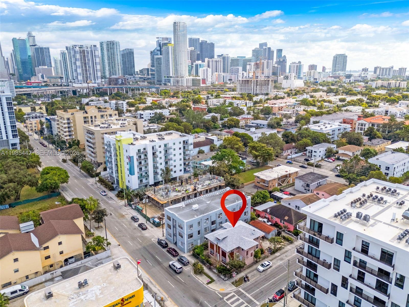 An aerial view shows a city neighborhood with a red location pin over a house — 676 SW 1st St, Miami FL 33130, MIAMI, FL