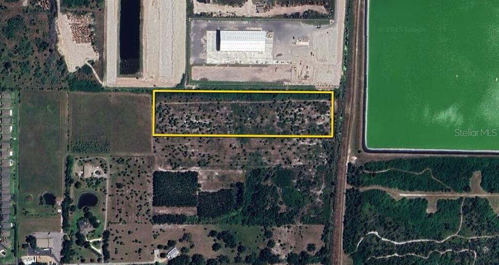 An aerial map view shows a rectangular plot of land outlined in yellow — 3285 ROWLAND DRIVE UNIT Tract G, PUNTA GORDA, FL