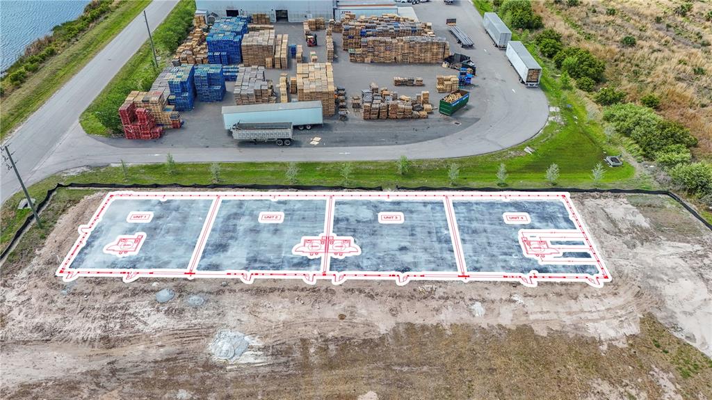 An aerial view shows a concrete foundation slab divided into four units with red markings — 8429 NORTHUP DRIVE UNIT 4, PUNTA GORDA, FL
