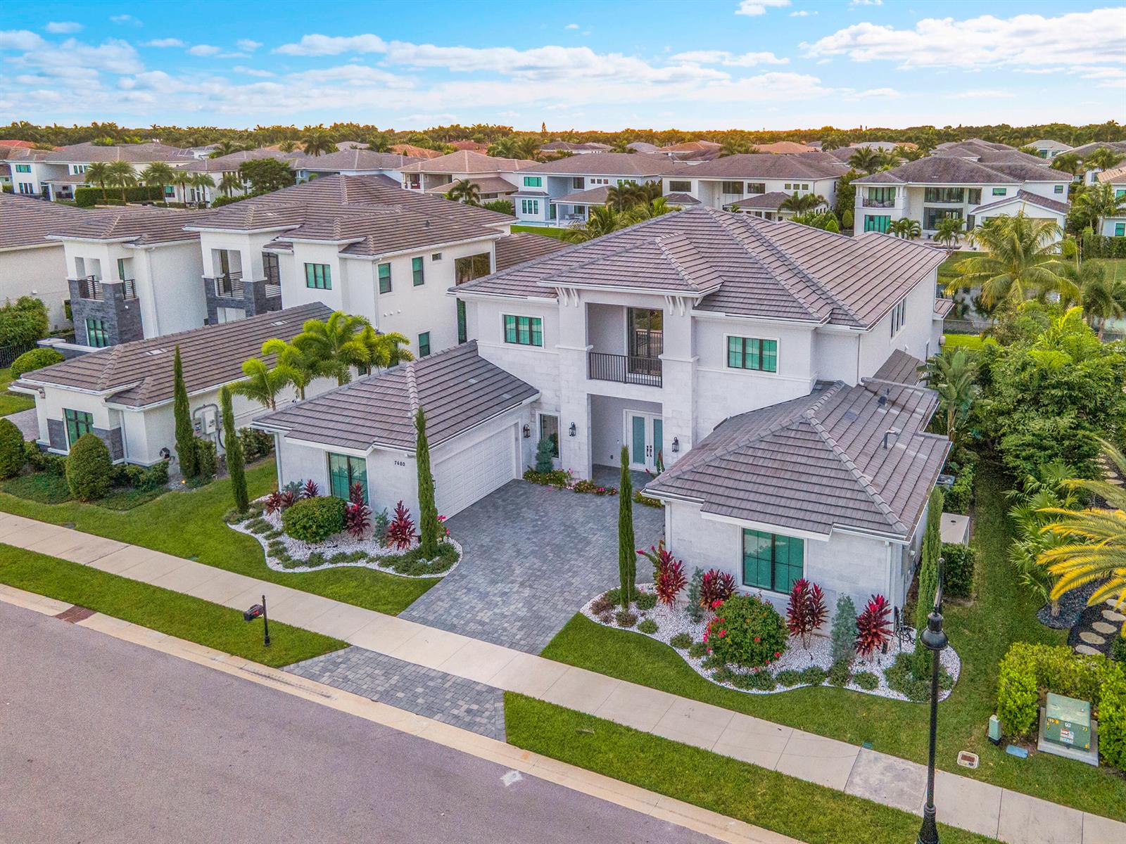 An aerial view shows a two-story suburban house with a tiled roof and paved driveway — 7480 NW 26th Way, Boca Raton FL 33496, BOCA RATON, FL