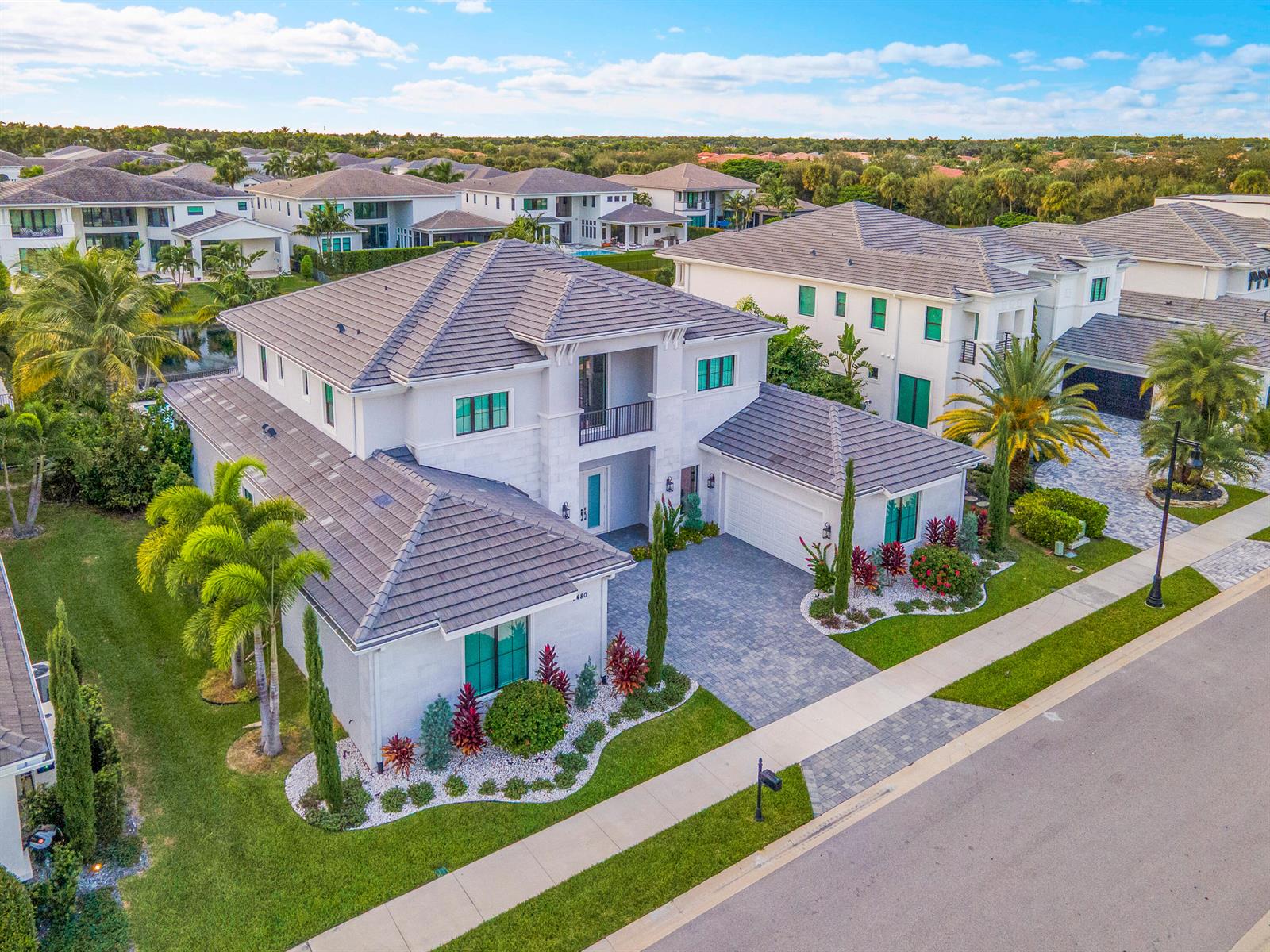 An aerial view of a two-story white house with a tiled roof and landscaped yard — 7480 NW 26th Way, Boca Raton FL 33496, BOCA RATON, FL
